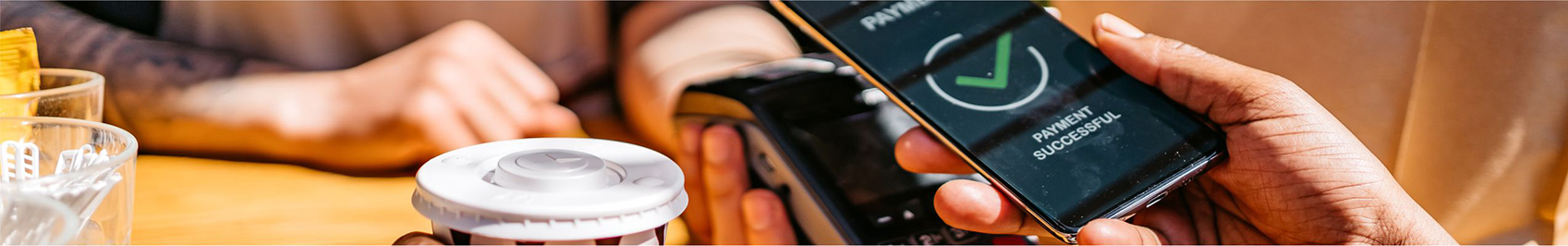 phone held over a point of sale device