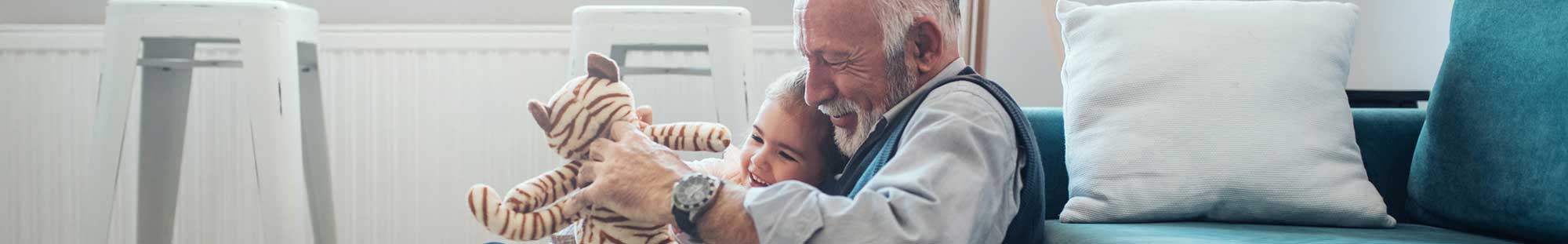 Senior citizen playing with a child