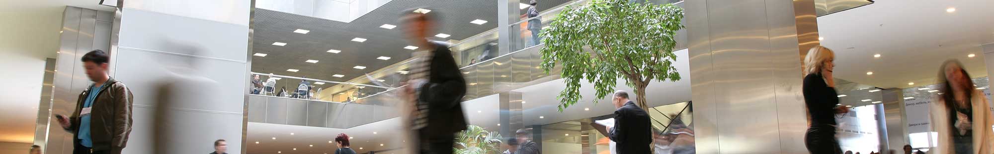 business people walking in a building lobby